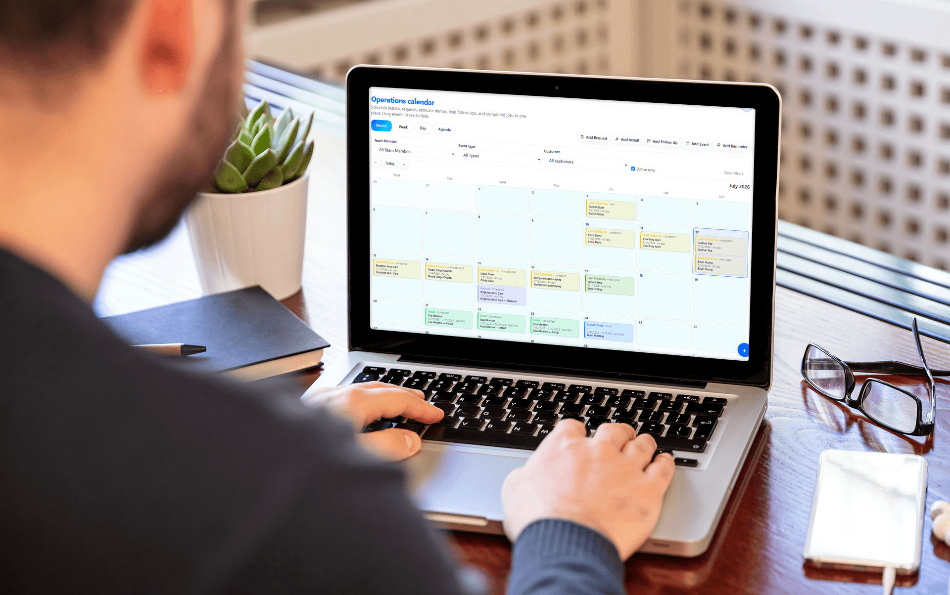 Service business owner reviewing a smooth software switch on a laptop